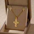 Detailed view of golden cross jewelry set with geometric pattern in a premium gift box - Maze Cross (TZ-430)