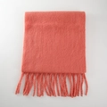 Thick orange-red mohair scarf with chunky tassels folded on a white background - Begonia Red