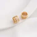Detailed macro of 14K gold plated lace spacer beads with micro-set cubic zirconia stones - 15# Retro Hollow Column / 10x7MM / 14K Gold
