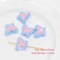 Detail view of 16x20mm UV iridescent acrylic bow beads for DIY jewelry making - Blue