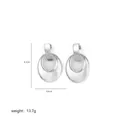 Macro detail of irregular silver geometric double-hoop earrings with mirror finish - Silver Double Nested Ring (A0190F)