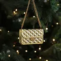 Golden quilted mini bag ornament with heart accent for festive Christmas tree decor - Chain Bag Model
