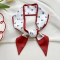Elegant narrow red and white silk scarf with H-pattern, tied in a stylish bow knot - Red Border Letter H