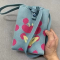 Light blue knitted shoulder bag with pink and yellow heart patterns and button closure - Pink Heart Blue Base