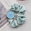 Detail of light blue ribbon scrunchie watch strap with golden dial and numbers - Light Blue