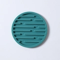 Teal blue round silicone drink coaster with raised horizontal non-slip lines - Drain Style / Nordic Green