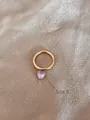 Anello in acciaio inossidabile dorato taglia 8 con ciondolo a cuore viola in zircone - US 8 / Rosa