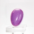 Portable purple egg-shaped hair comb with silver glitter and soft detangling bristles - Starry Purple Transparent