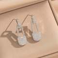 Macro detail of silver safety pin earrings set with shimmering cubic zirconia stones - Silver Safety Pin Stud Earrings (835)
