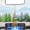 Close-up of golden sun pendant car hanging with pink crystal beads and pearls - Pink Pearl Crystal Sun Pendant