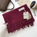 Wine red cashmere-feel scarf with tassels and brand tag on a stylish autumn display - 200x68cm / Burgundy