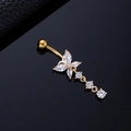 Macro detail of golden butterfly navel ring with marquise and round cubic zirconia crystals - Three Round Zircon Butterfly Gold