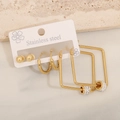 Close-up of gold stainless steel earrings set including ball studs and rhinestone hoops - Square (4#)