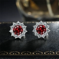 Sparkling sunflower stud earrings with central red zircon and white gemstone halo - Red