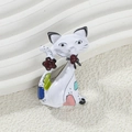 Detailed view of white enamel cat brooch with red flower and colorful spots decoration - White Cat