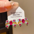Boucles d'oreilles nœud plaquées or avec pierres rouges et accents bleus en argent 925 - Tige en Argent 925 - Nœud Papillon Pierre Rouge Doré