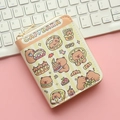 Detail of cute Capybara cartoon wallet with zipper on a desk with keyboard - Pastry Collection Capybara