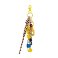 Detail of colorful DIY mini padlock bag charm with flower pendant and braided rope accessory - Yellow