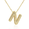 Macro shot of gold-plated puffy letter N pendant with pavé-set shimmering zircons - N-Gold-Small