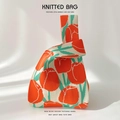 Close-up of tulip floral knit bag with high-quality textured fabric and chic design - Orange Tulip