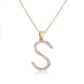 Detail of 18K gold-plated initial S pendant set with rectangular baguette-cut zircons - Letter S