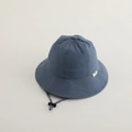 Detail of blue sun hat with brand tag, adjustable windproof drawstring and stopper - 50cm (1-3 Years) / Blue