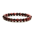 Red and black tiger eye natural stone beaded stretch bracelet on a white background - Red