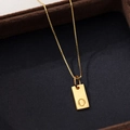 Gold square necklace featuring letter O pendant on minimalist silver chain - Letter O / Gold