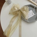Elegant champagne satin and organza oversized bow hair clip with pearl accents - Apricot