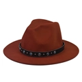 Detail of rust orange fedora hat featuring black band with turquoise beads and studs - Caramel color