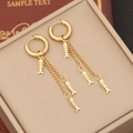 Detailed shot of gold fishbone tassel earrings displayed on a vintage jewelry box - 6# Fishbone Tassel Style