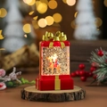 Detail der roten Weihnachts-Schneekugel-Lampe mit Weihnachtsmann auf einem Holzsockel - Roter Weihnachtsmann & Hirsch