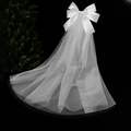 White bridal tulle veil featuring a large satin bow and waterfall mesh ribbon design - Waterfall Style Bow Veil / White