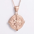 Macro shot of rose gold compass pendant with sandblasted finish and direction letters - 450*1.5mm Chain / Rose Gold