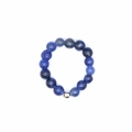 Detailed view of 4mm blue stone elastic bead ring with a metallic silver accent bead - Blue Sodalite
