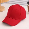 Close-up of red solid cotton baseball cap with six-panel structure and curved brim design - 52cm(Adjustable) / Burgundy