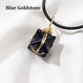 Blue goldstone Merkaba star pendant with gold wire wrap and black woven cord - Blue Goldstone