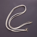 Double-layer pearl and gold metal chain strap featuring a black camellia floral charm - White Leather Woven Double Chain Camellia