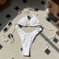 White smocked bikini set with halter top and high-cut bottom on beige rug - S / White