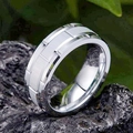 Macro shot of silver titanium steel ring with brushed center on dark natural stone - Size 6 / Silver