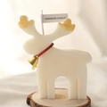 Handmade reindeer candle with gold antlers and red ribbon for Christmas decor - White Reindeer