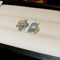 Elegant gold leaf earrings with blue enamel and marquise crystals in a jewelry box - 82# Zircon Flower Studs
