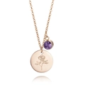 Detail of rose gold necklace featuring a floral engraved disc and purple gemstone pendant - June Rose