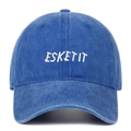 Detail of white ESKETIT 3D embroidery on washed royal blue cotton baseball cap fabric - Dark Blue