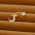 Macro detail of golden crescent moon belly ring with sparkling cubic zirconia on brown velvet - Moon Pendant Style (Y20370-17)