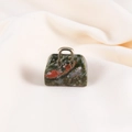 Miniature green quartz handbag pendant with red patterns and gold handle details - Unakite
