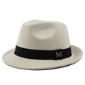 Macro detail of silver M logo on gray suede fedora hat with black ribbon band - M (56-58cm) / Suede Beige