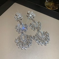 Silver-plated tassel earrings featuring tiered flower leaf petals and micro-paved cubic zirconia - 93# Silver Needle - Silver In Color.