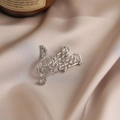 Elegant silver treble clef brooch with shimmering rhinestones on champagne silk - 572# Note
