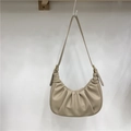 Detail of beige pleated cloud bag with soft PU leather texture and crescent shape - Apricot